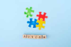 international autism awareness day - word autisn and jigsaw puzzles